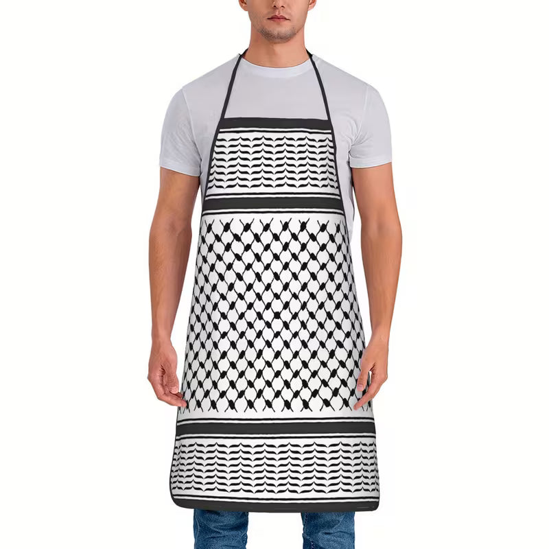Person wearing a black and white patterned apron on a white background